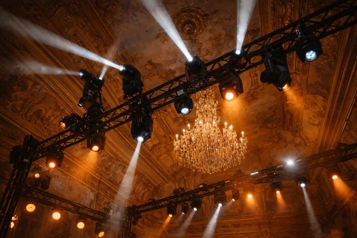 Lighting truss and crystal chandelier in a gilded heritage ballroom during a BTQ gala production