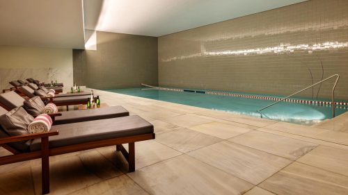 Vidago Spa indoor pool, a Siza-designed white-marble pool with daylight